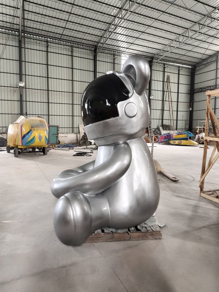 Space bear fiberglass sculpture displayed in commercial exhibition environment