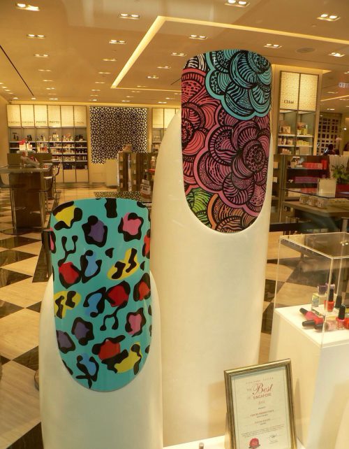 Tolili custom fiberglass giant finger sculptures displaying colorful nail art in a luxury salon