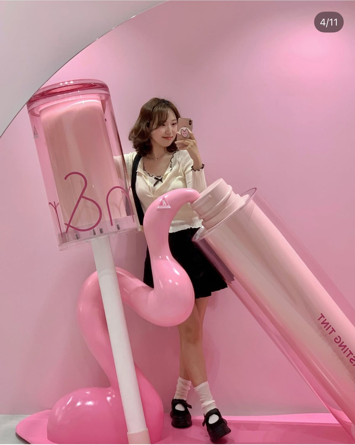 Tolili giant lip tint fiberglass sculpture in a pink-themed retail store