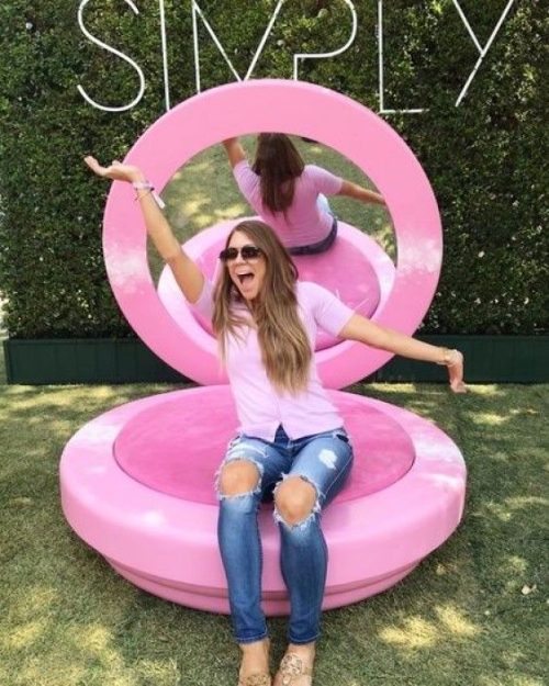 Tolili giant pink makeup compact fiberglass sculpture at an outdoor event