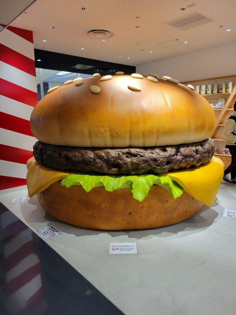 burger sculpture display oversized food installation in mall
