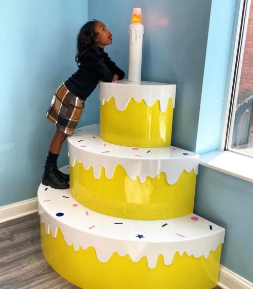 yellow drip cake sculpture display installation