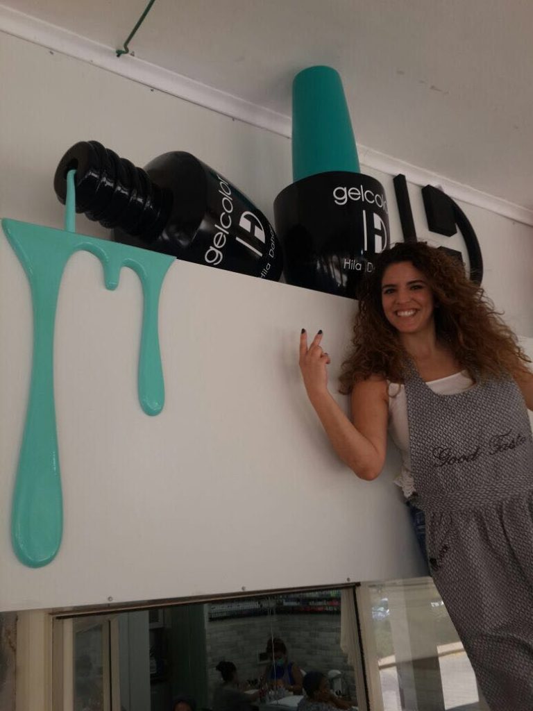 giant gel nail polish sculpture installation for beauty store display and nail salon storefront marketing art
