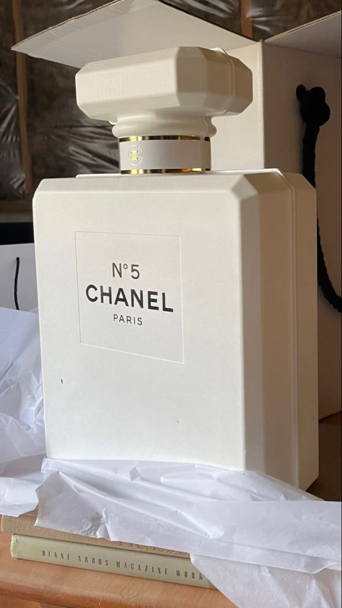giant perfume bottle sculpture installation luxury retail display CHANEL inspired Tolili installation