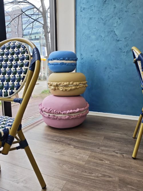 macaron sculpture display installation in café interior