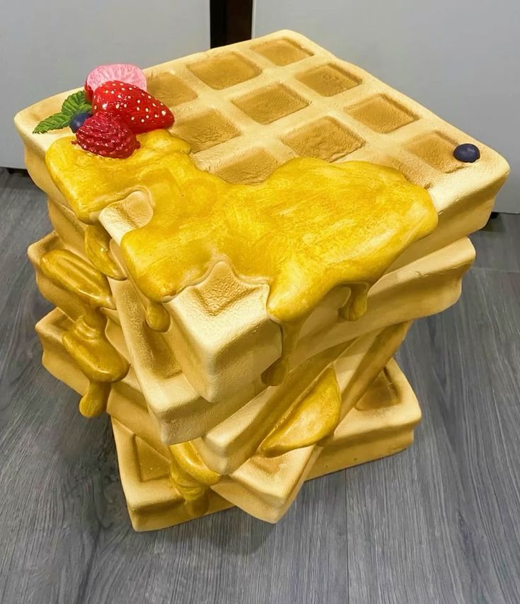 waffle sculpture display giant dessert installation with syrup and fruit